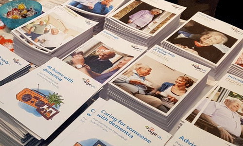 Age UK information guides laid out at the Alzheimer's Show