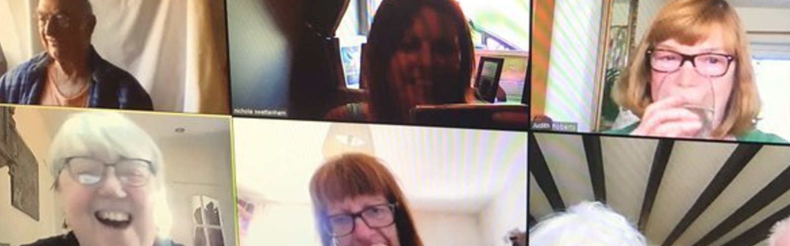 A group of older people speaking on a video call