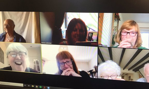 A group of older people talking on a video call