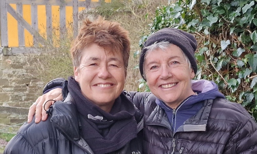 Sisters Jean and Jo, smiling for the camera